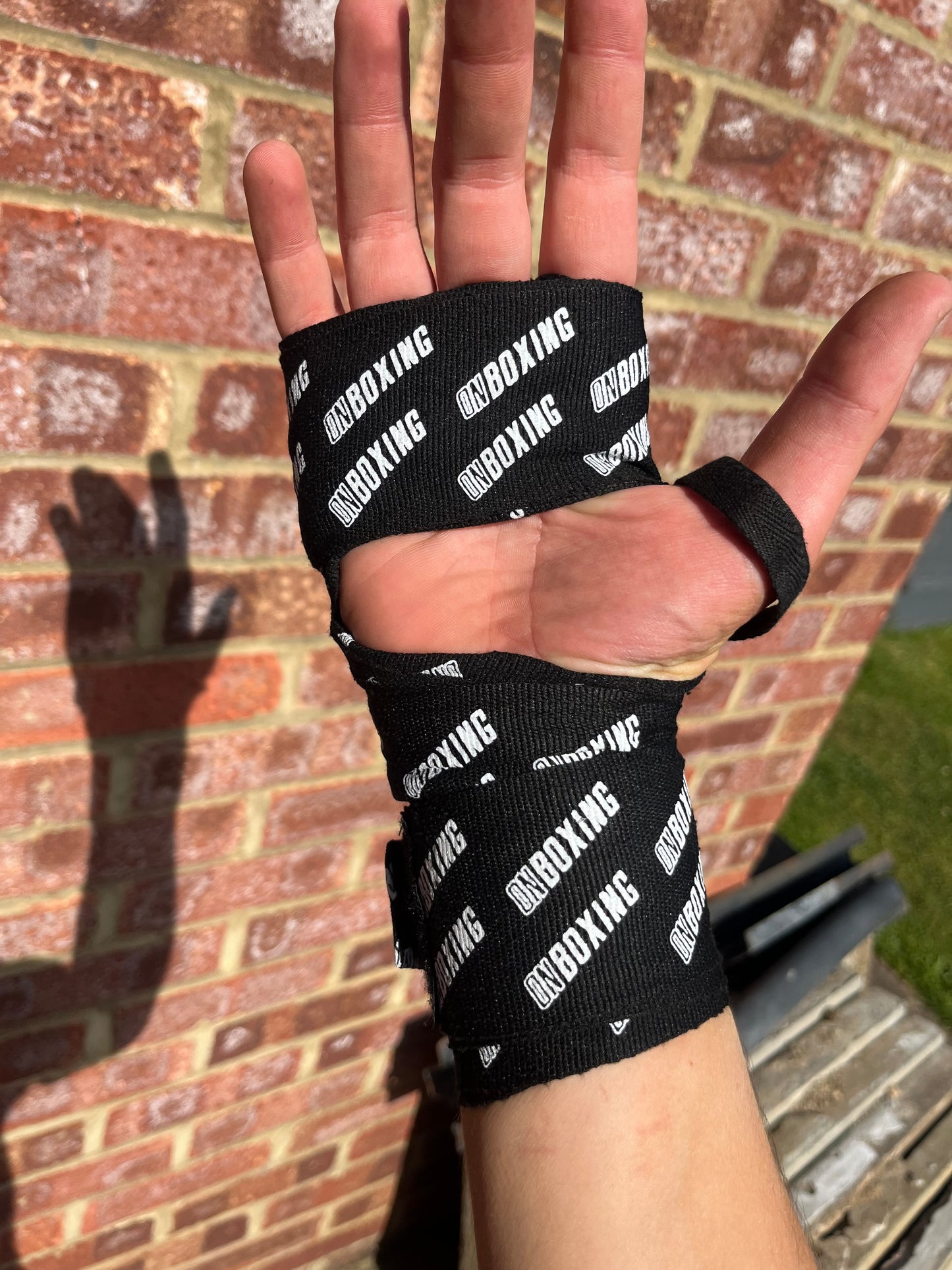 on boxing hand wraps black / white